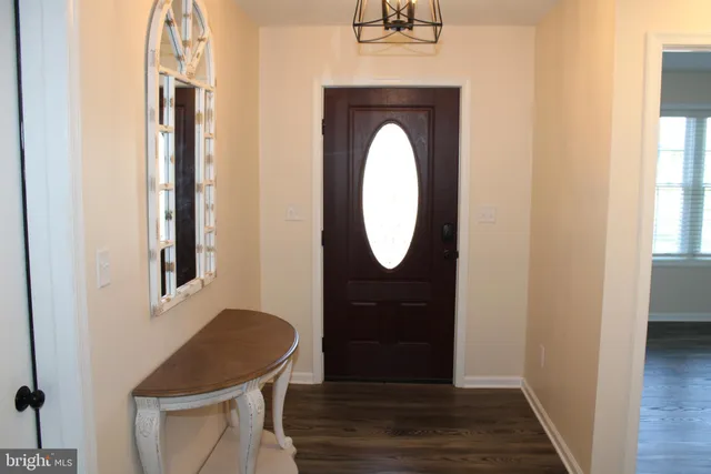 a kitchen with appliances a sink and cabinets