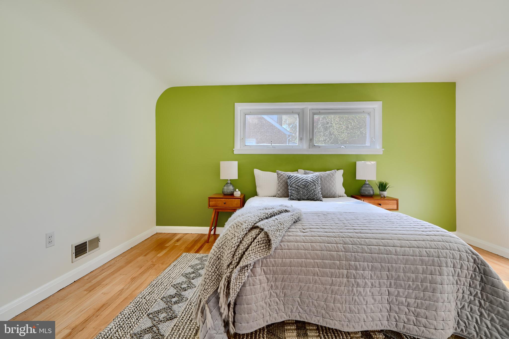 1316 Glendale Road Baltimore, MD 21239 - Photo 21 of 37 a bedroom with a bed and cupboard