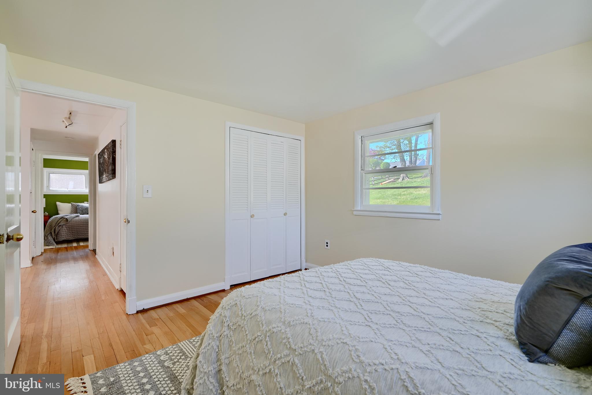 1316 Glendale Road Baltimore, MD 21239 - Photo 28 of 37 a bedroom with a bed and a wooden floor