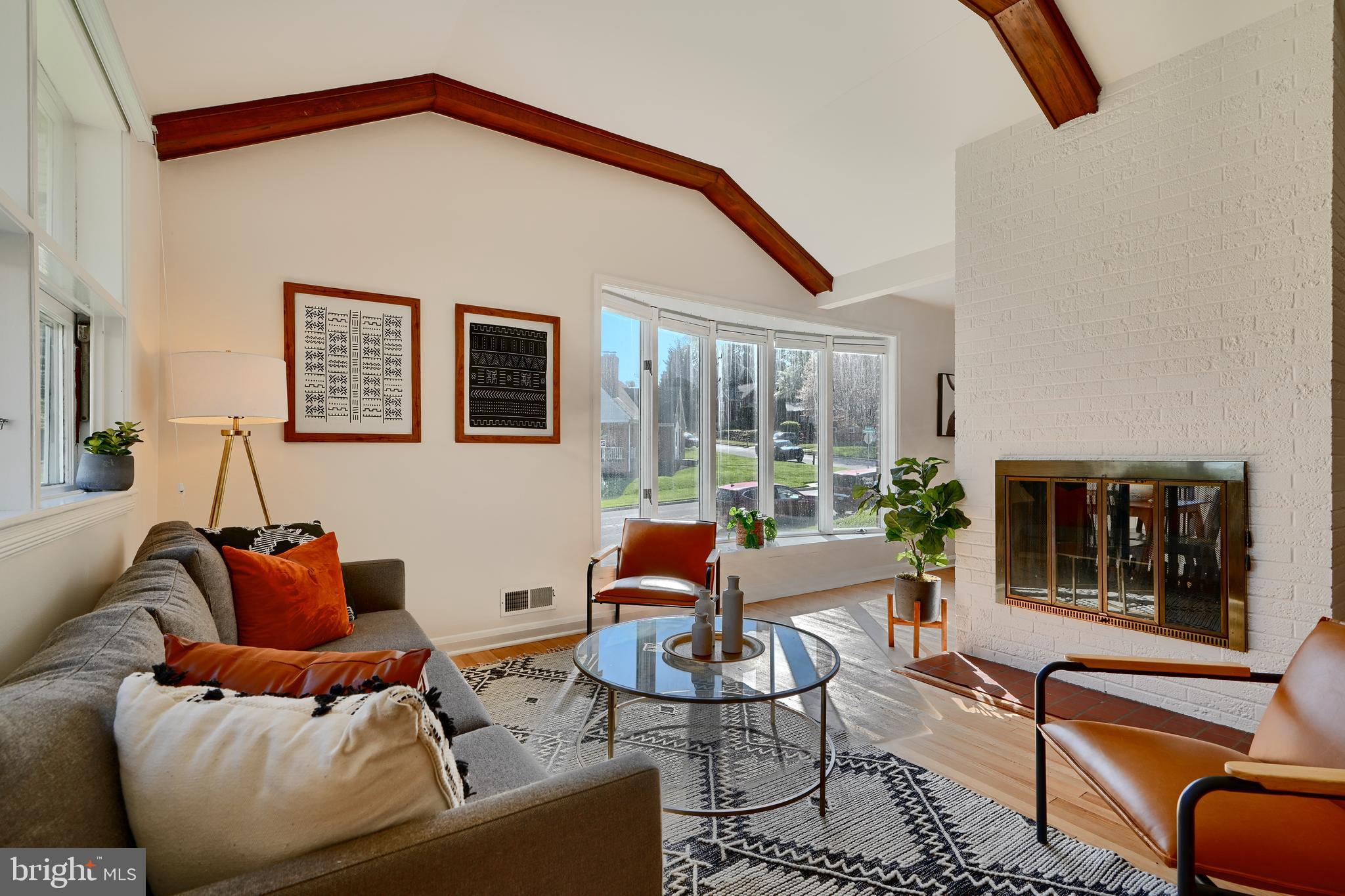 1316 Glendale Road Baltimore, MD 21239 - Photo 3 of 37 a living room with furniture a lamp and a fireplace