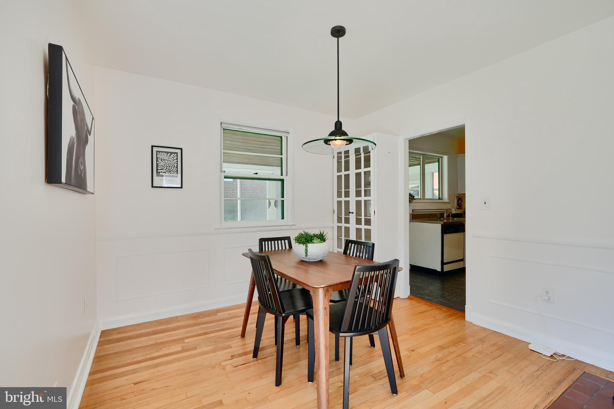 1316 Glendale Road Baltimore, MD 21239 - Photo 10 of 37 a view of a dining room with furniture and wooden floor