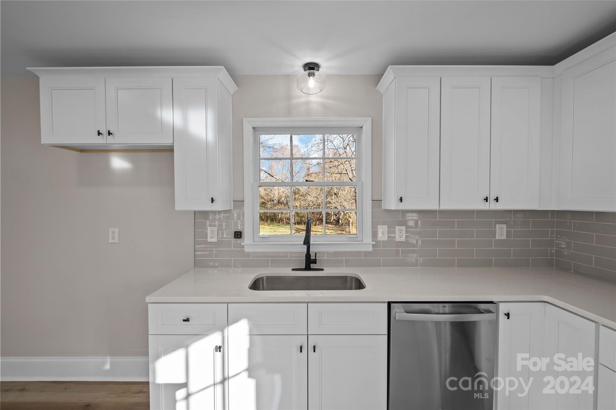 5808 Woody Grove Road Indian Trail, NC 28079 - Photo 12 of 30 a kitchen with a sink and cabinets