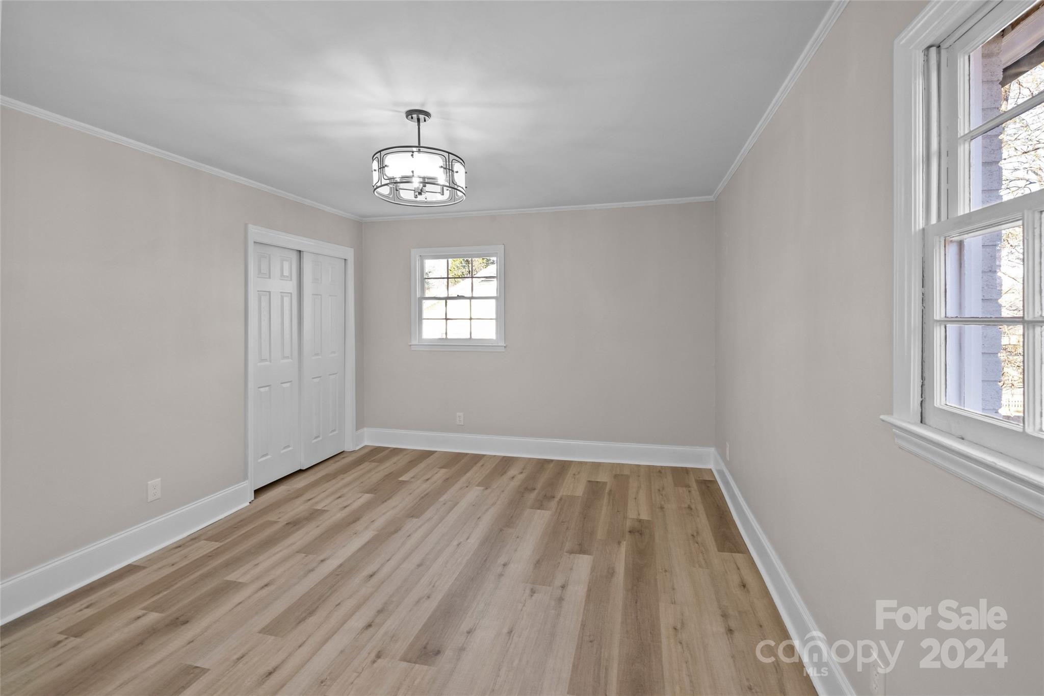 5808 Woody Grove Road Indian Trail, NC 28079 - Photo 18 of 30 wooden floor in an empty room with a window