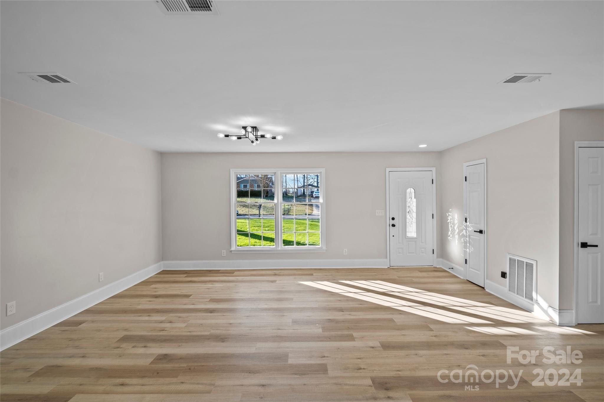 5808 Woody Grove Road Indian Trail, NC 28079 - Photo 5 of 30 a view of an empty room with a window