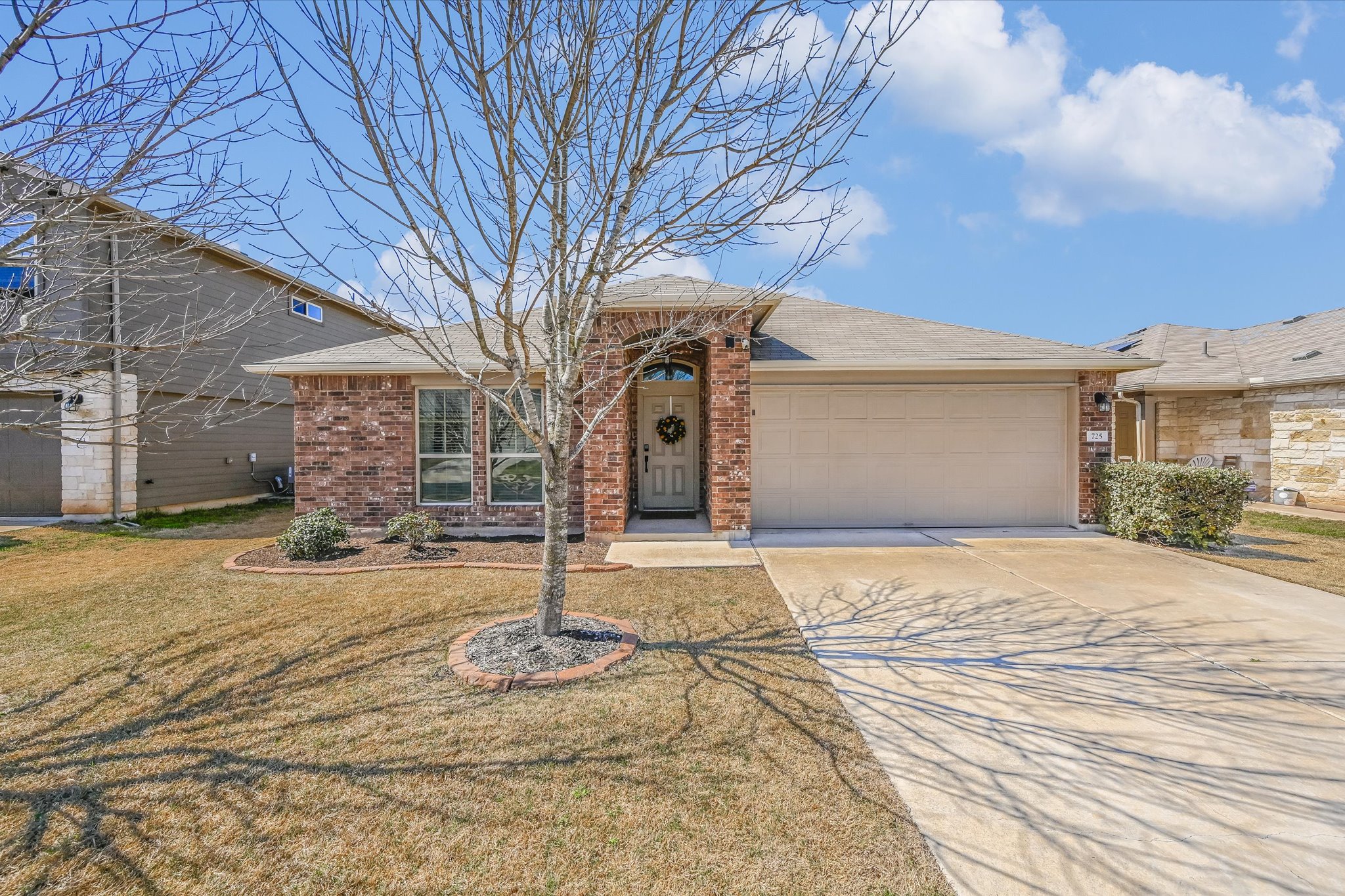 725 Pinnacle Drive Georgetown, TX 78626 - Photo 1 of 20 a front view of a house with parking space