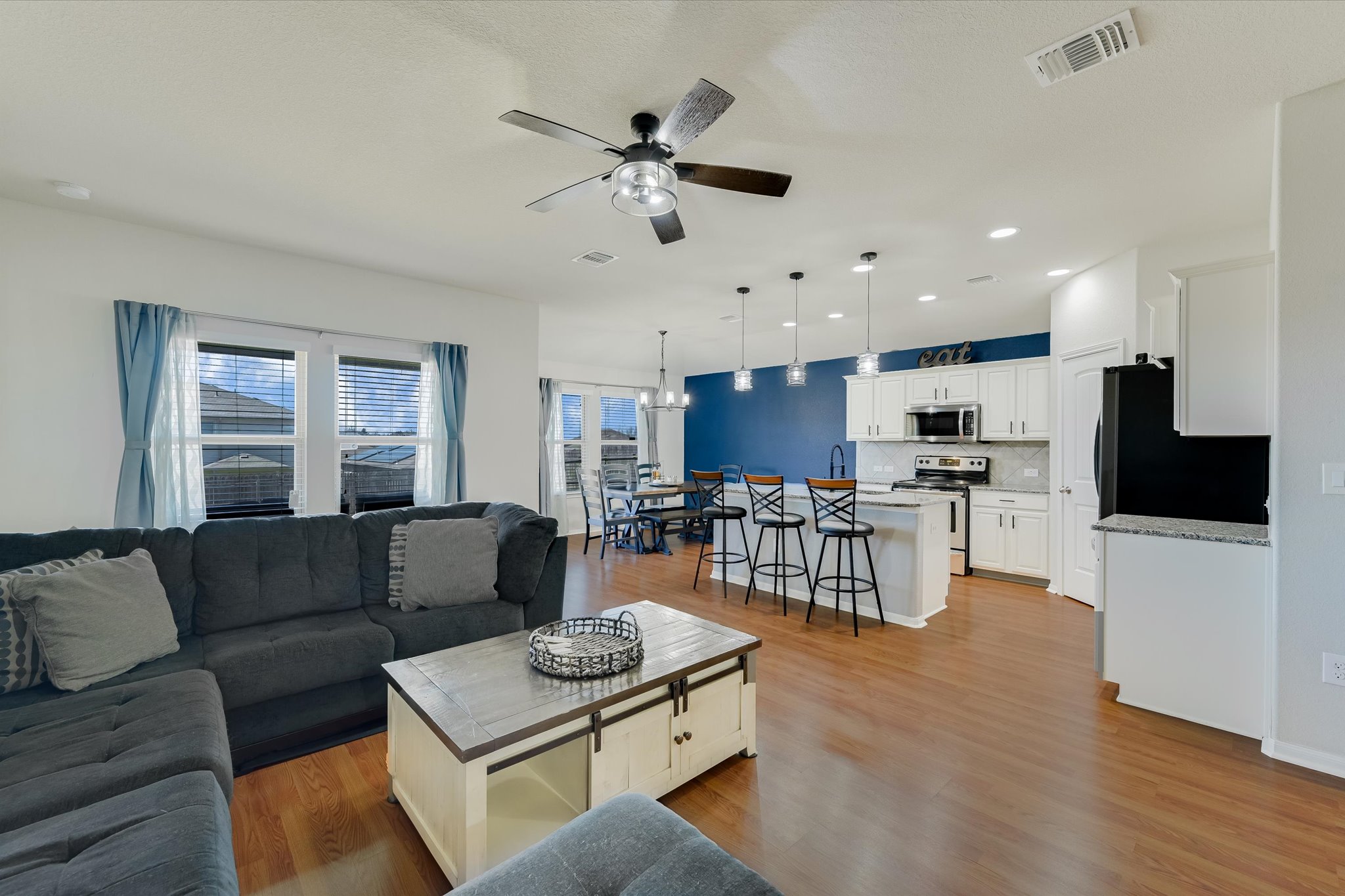 725 Pinnacle Drive Georgetown, TX 78626 - Photo 2 of 20 a living room with furniture and kitchen view