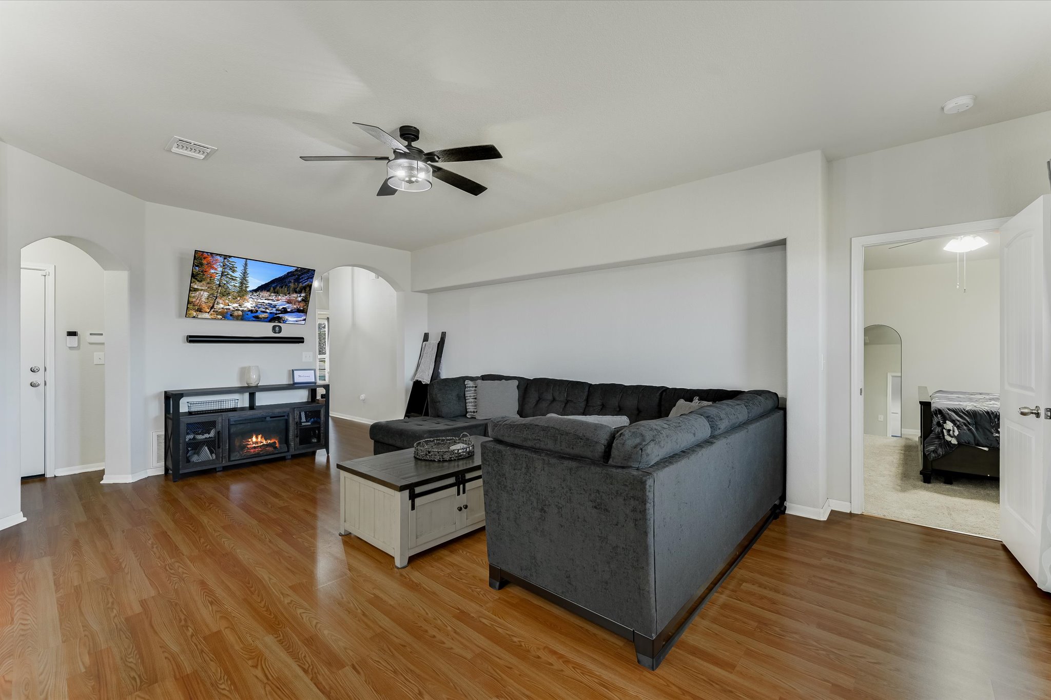 725 Pinnacle Drive Georgetown, TX 78626 - Photo 4 of 20 a living room with furniture and a wooden floor