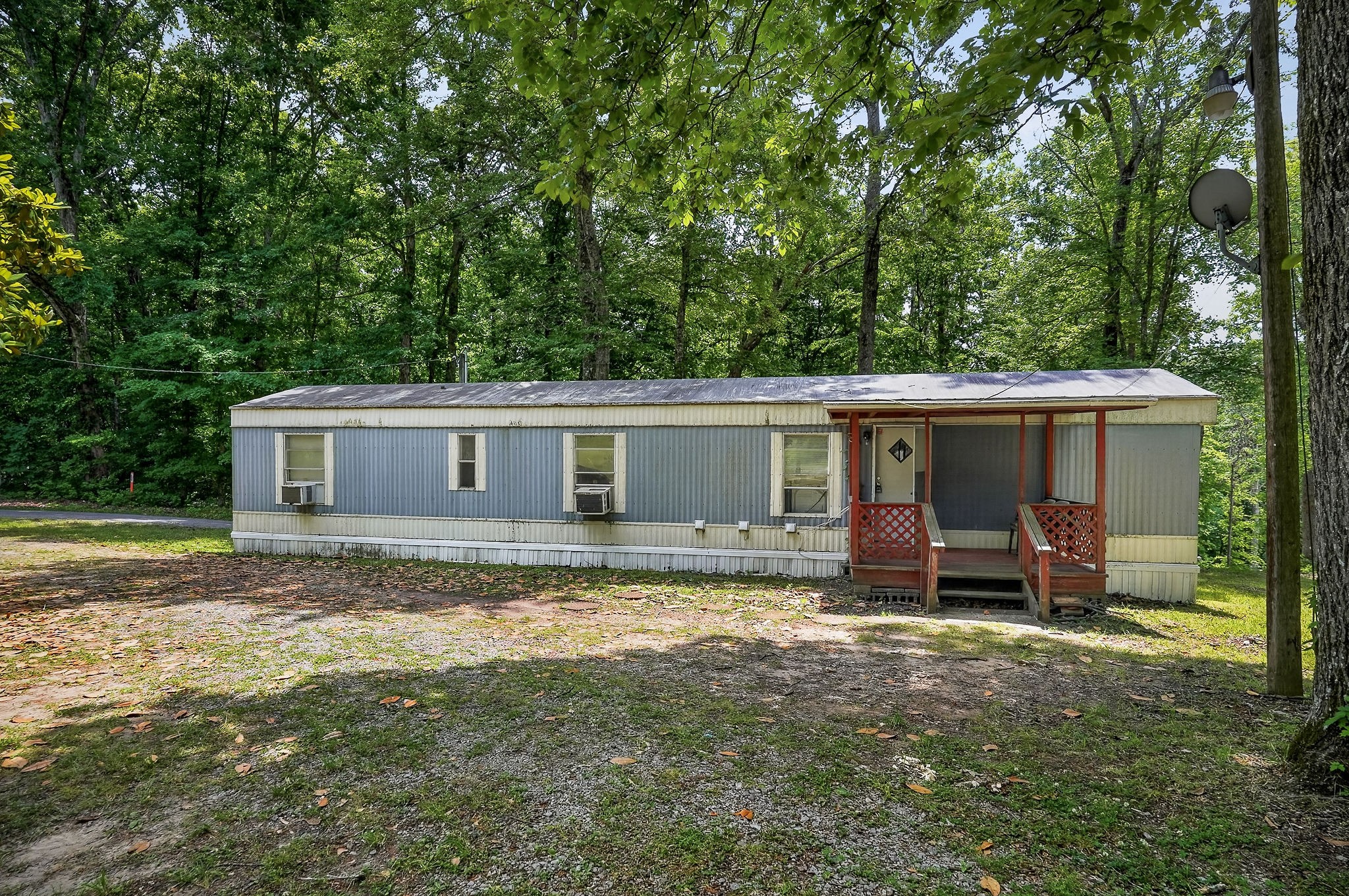 5682 Pates Ford Road Smithville, TN 37166 - Photo 4 of 12 a view of a house with a yard and sitting area