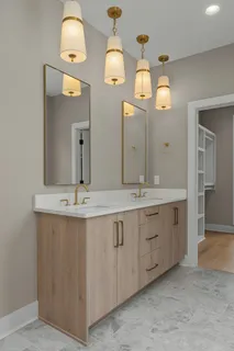 a bathroom with a double vanity sink and a mirror