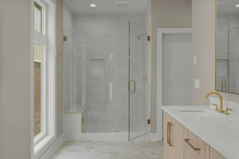 a bathroom with a shower sink and toilet
