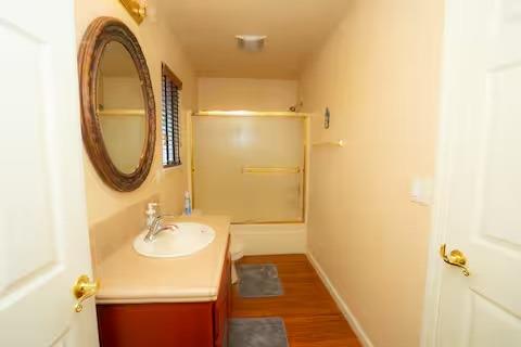 1180 Sanborn Road Yuba City, CA 95993 - Photo 15 of 26 a bathroom with a sink and a mirror