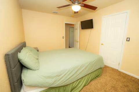 1180 Sanborn Road Yuba City, CA 95993 - Photo 16 of 26 a bedroom with a bed and a ceiling fan