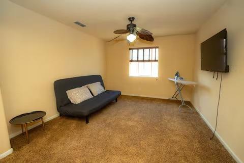 1180 Sanborn Road Yuba City, CA 95993 - Photo 18 of 26 a living room with furniture and a flat screen tv