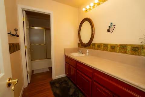 1180 Sanborn Road Yuba City, CA 95993 - Photo 19 of 26 a bathroom with a sink and a mirror