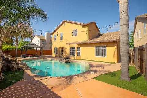 1180 Sanborn Road Yuba City, CA 95993 - Photo 21 of 26 a view of a house with a swimming pool