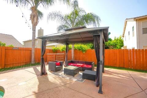 1180 Sanborn Road Yuba City, CA 95993 - Photo 23 of 26 a backyard of a house with a table and chairs