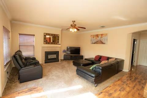 1180 Sanborn Road Yuba City, CA 95993 - Photo 6 of 26 a living room with furniture a fireplace and a flat screen tv