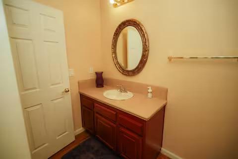 1180 Sanborn Road Yuba City, CA 95993 - Photo 10 of 26 a bathroom with a sink and a mirror