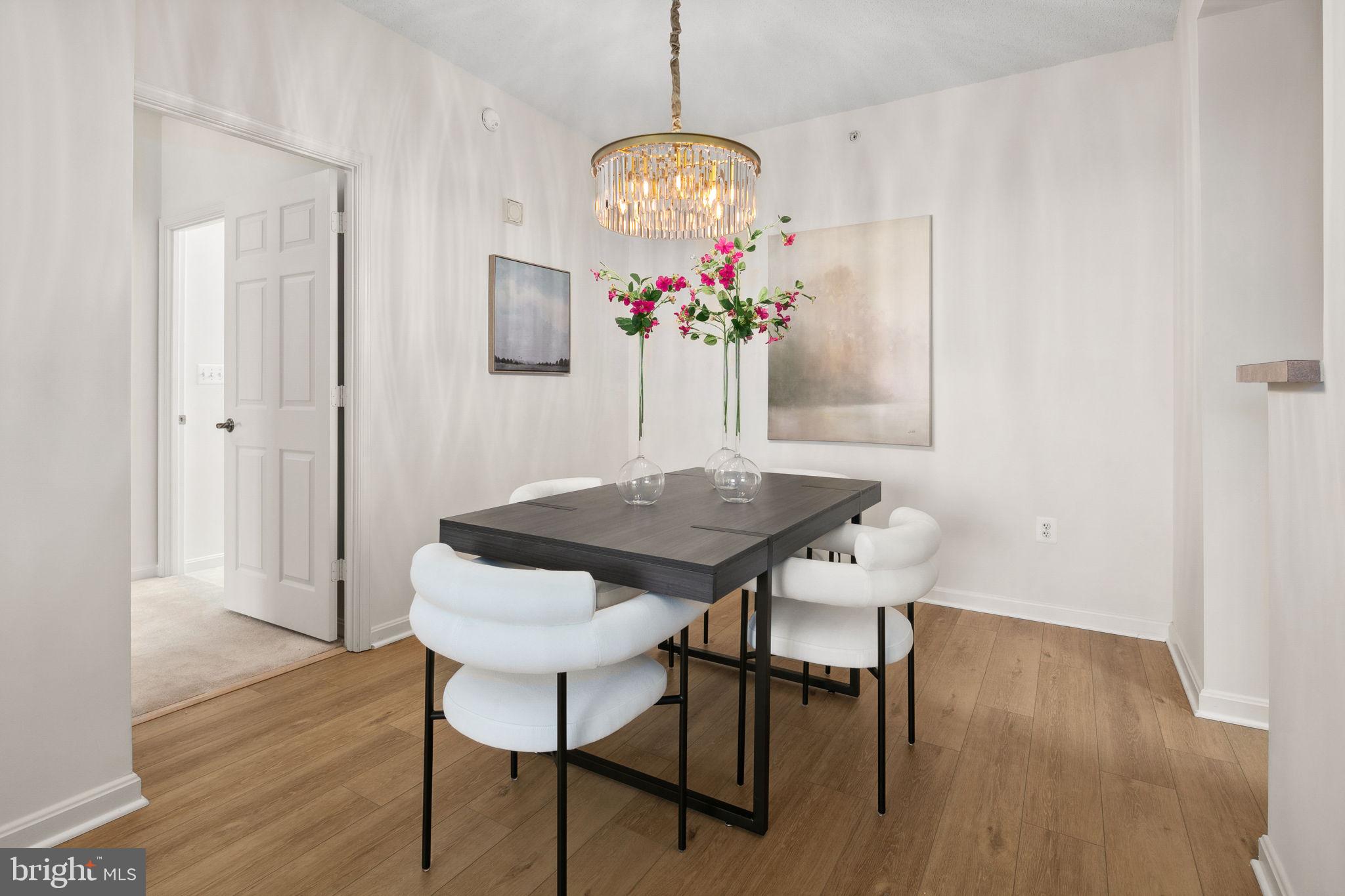 19355 Cypress Ridge Terrace, Unit 803 Leesburg, VA 20176 - Photo 11 of 38 a view of a dining room with furniture and wooden floor