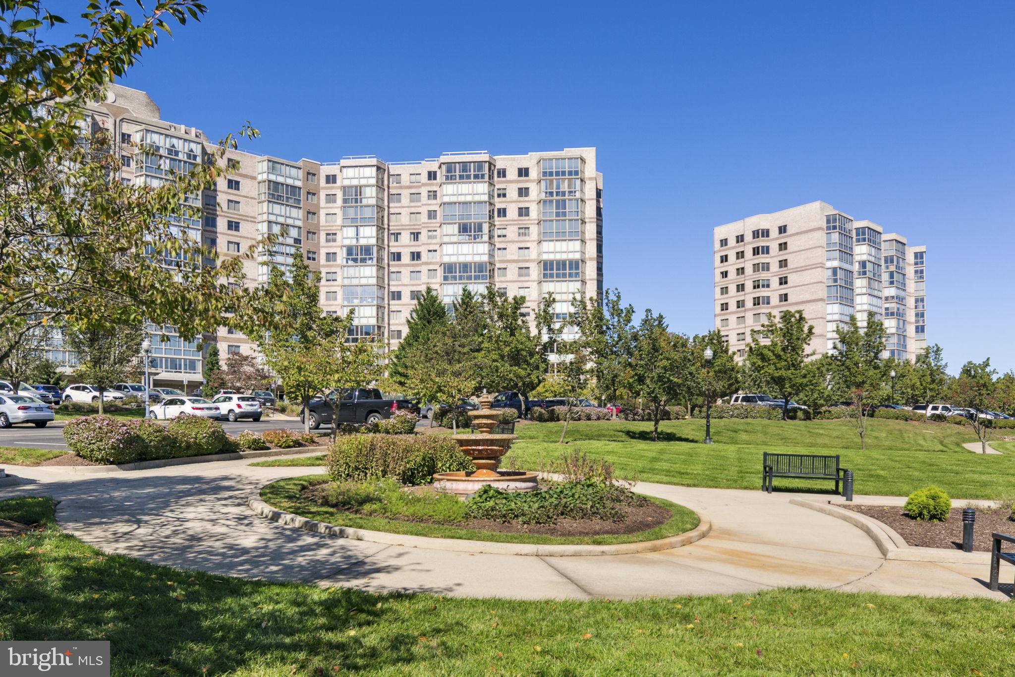 19355 Cypress Ridge Terrace, Unit 803 Leesburg, VA 20176 - Photo 34 of 38 a view of a city with tall buildings and a big yard