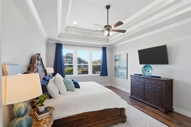 a bedroom with furniture and flat screen tv