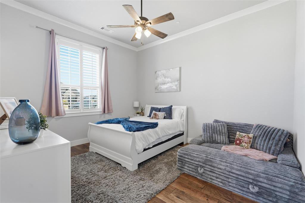 640 Maggie Trail Lucas, TX 75002 - Photo 25 of 40 a bedroom with a bed and window