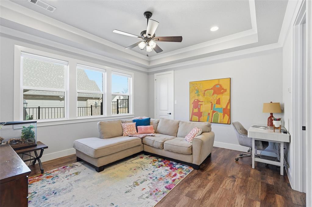 640 Maggie Trail Lucas, TX 75002 - Photo 27 of 40 a living room with furniture and wooden floor