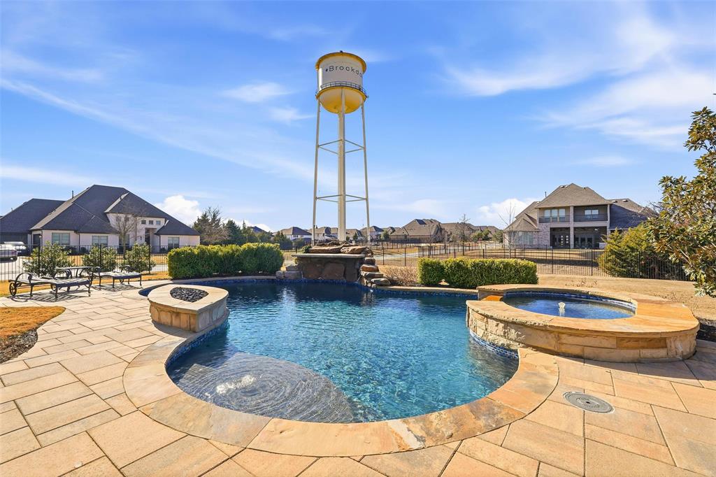 640 Maggie Trail Lucas, TX 75002 - Photo 33 of 40 a view of a swimming pool with lounge chairs