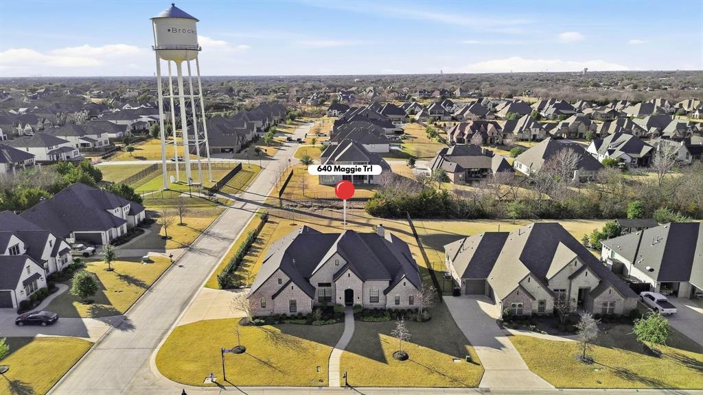 640 Maggie Trail Lucas, TX 75002 - Photo 39 of 40 an aerial view of a swimming pool with seating space