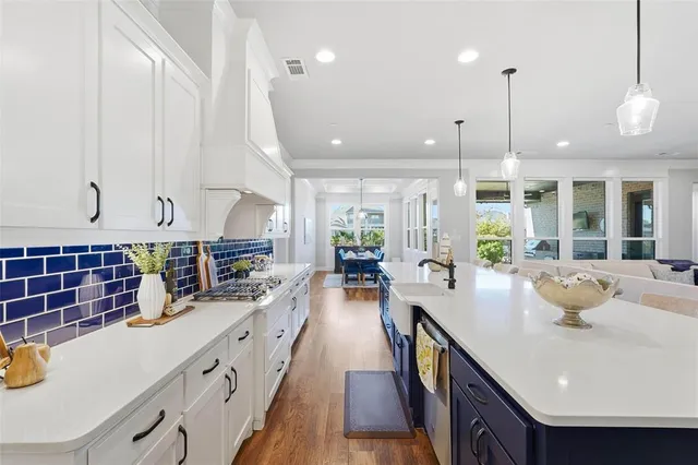 a kitchen with counter space appliances and a large window