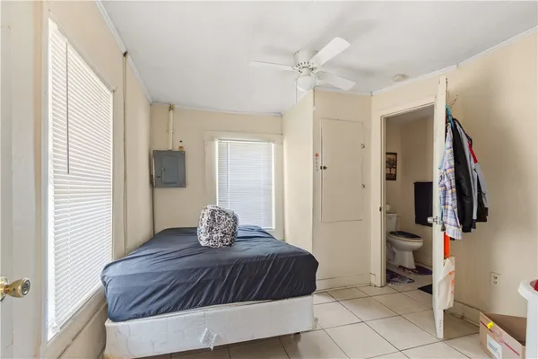 a bedroom with a bed and walk in closet