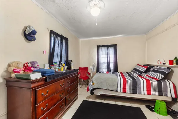 a bedroom with a bed and dresser