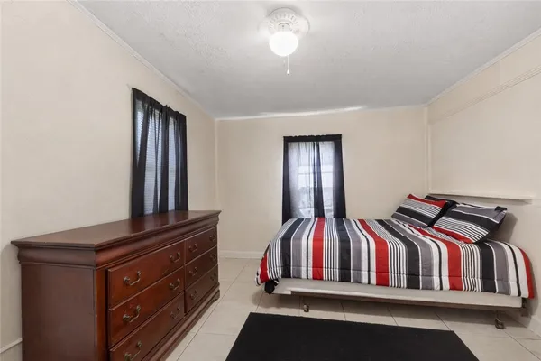 a view of bedroom with furniture and staircase