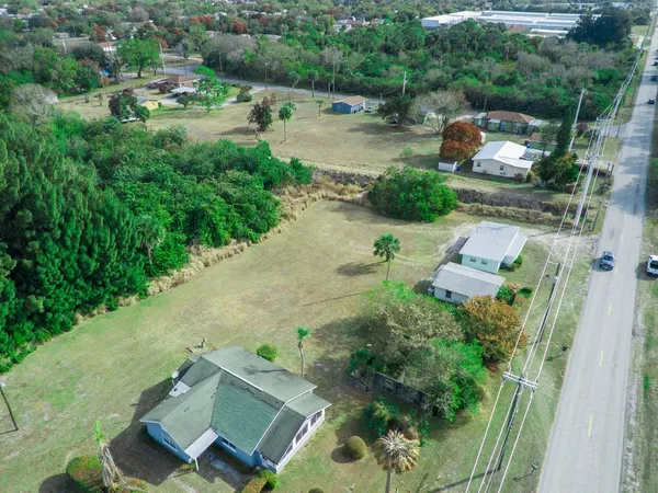 an aerial view of a house with outdoor space