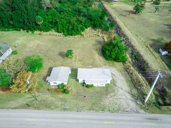 an aerial view of a house with outdoor space