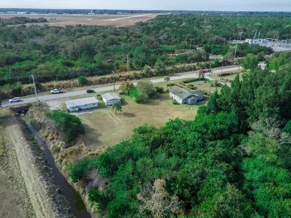 an aerial view of residential house with outdoor space