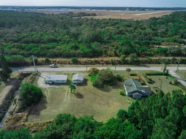an aerial view of a house with pool