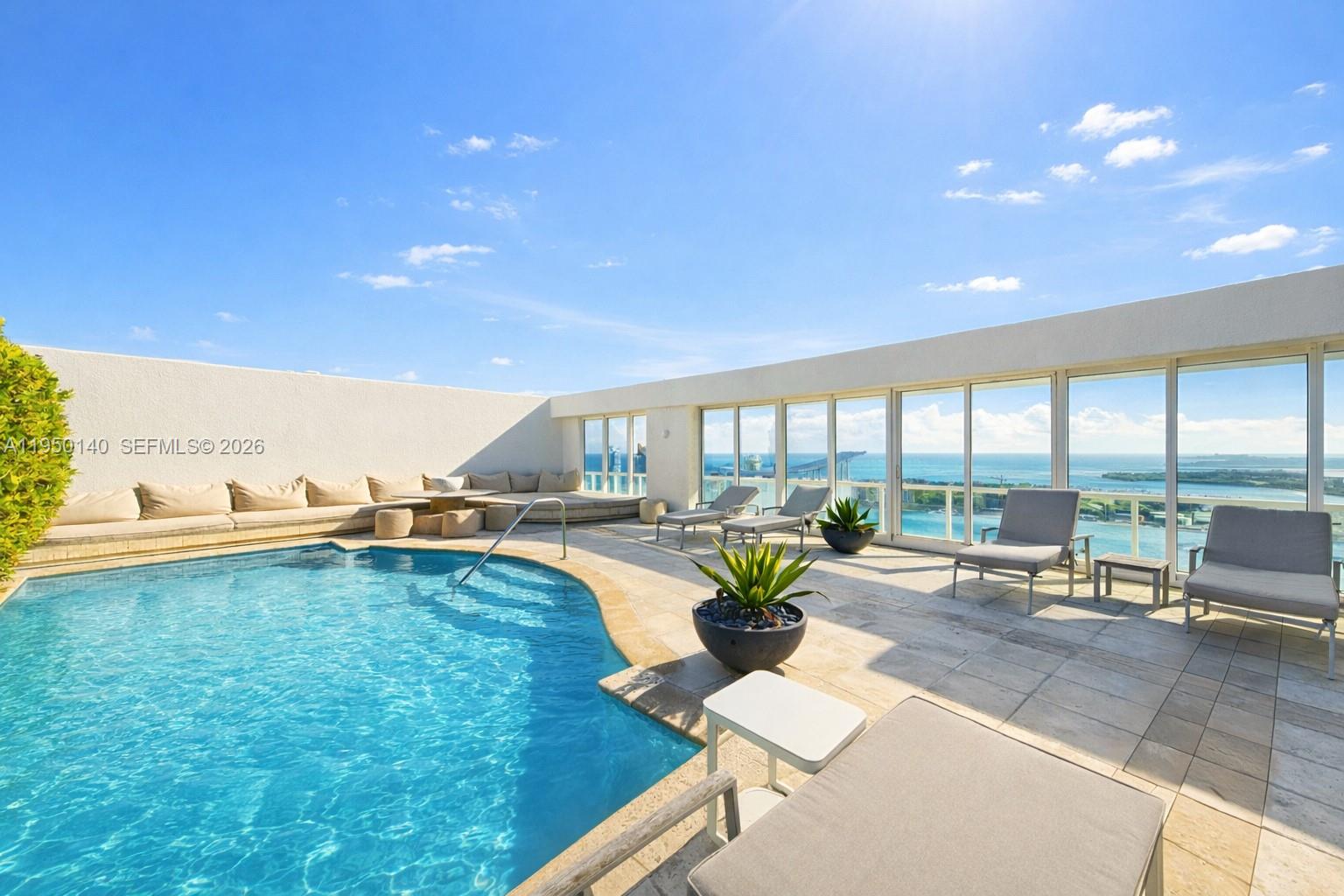 450 Alton Road, Unit PH1 Miami Beach, FL 33139 - Photo 11 of 98 a living room with furniture and floor to ceiling window