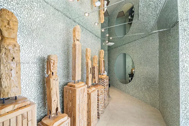 a view of a hallway with wooden floor and stairs