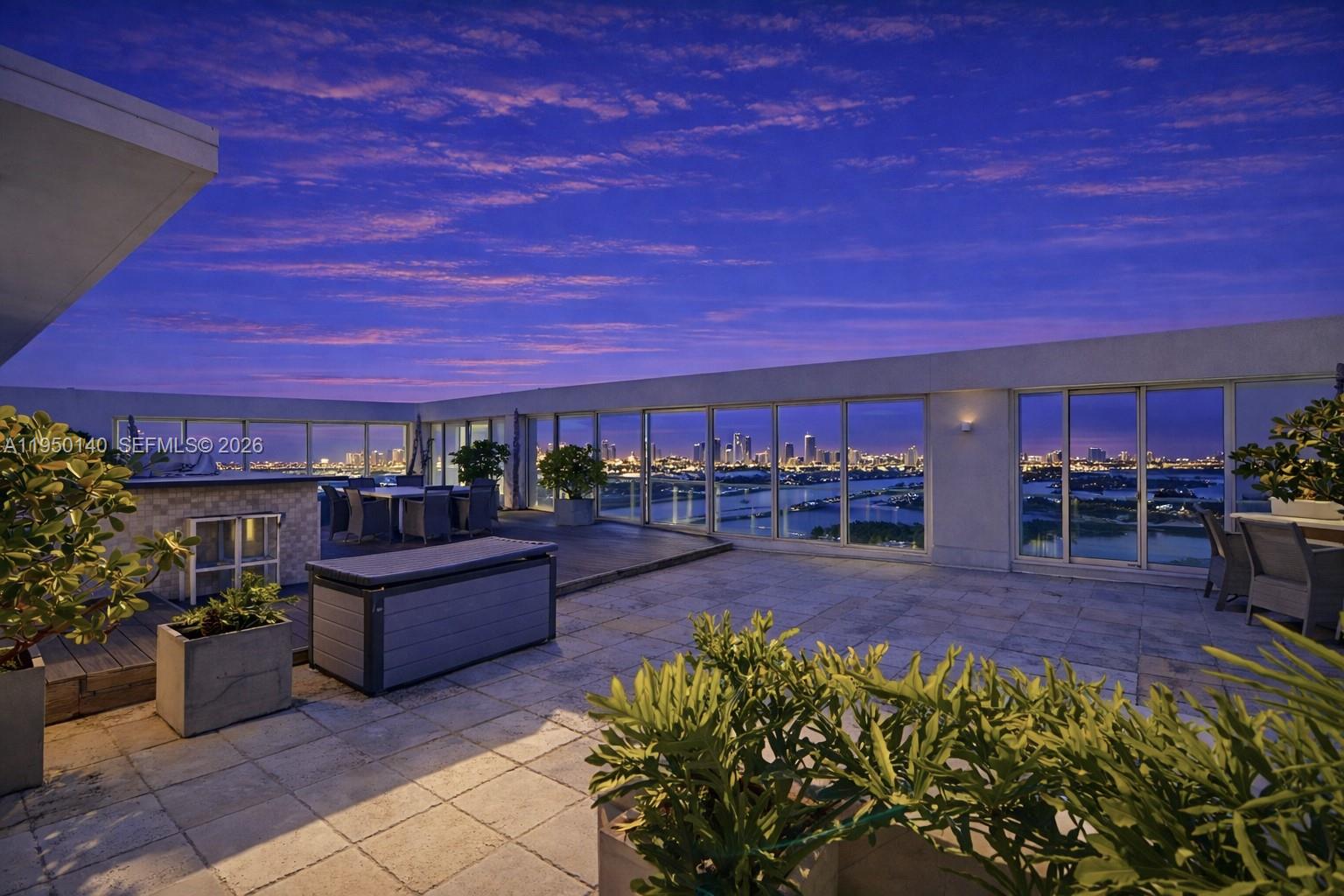 450 Alton Road, Unit PH1 Miami Beach, FL 33139 - Photo 27 of 98 a view of a patio with couches and potted plants