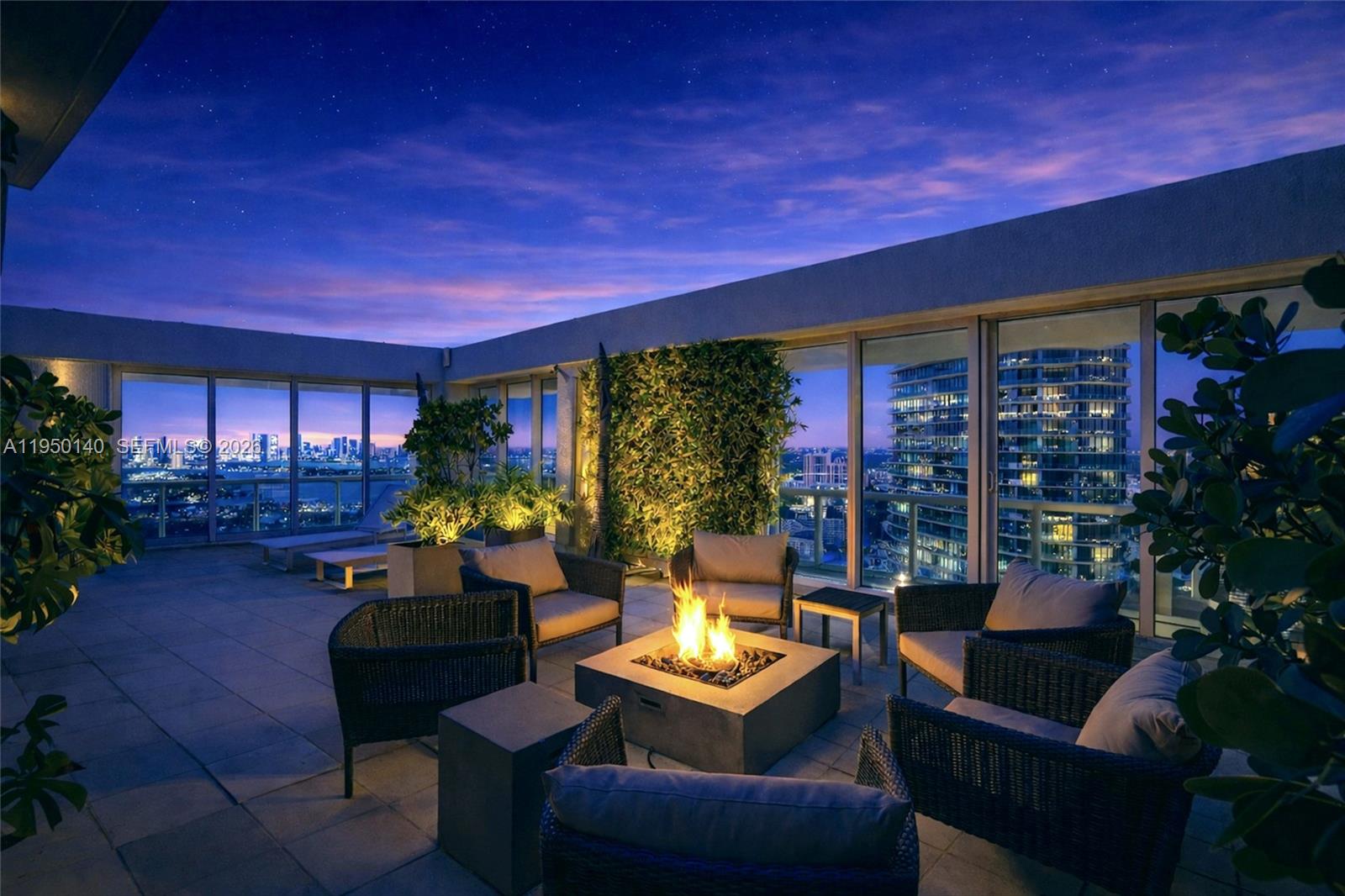 450 Alton Road, Unit PH1 Miami Beach, FL 33139 - Photo 28 of 98 a outdoor living space with furniture and garden view