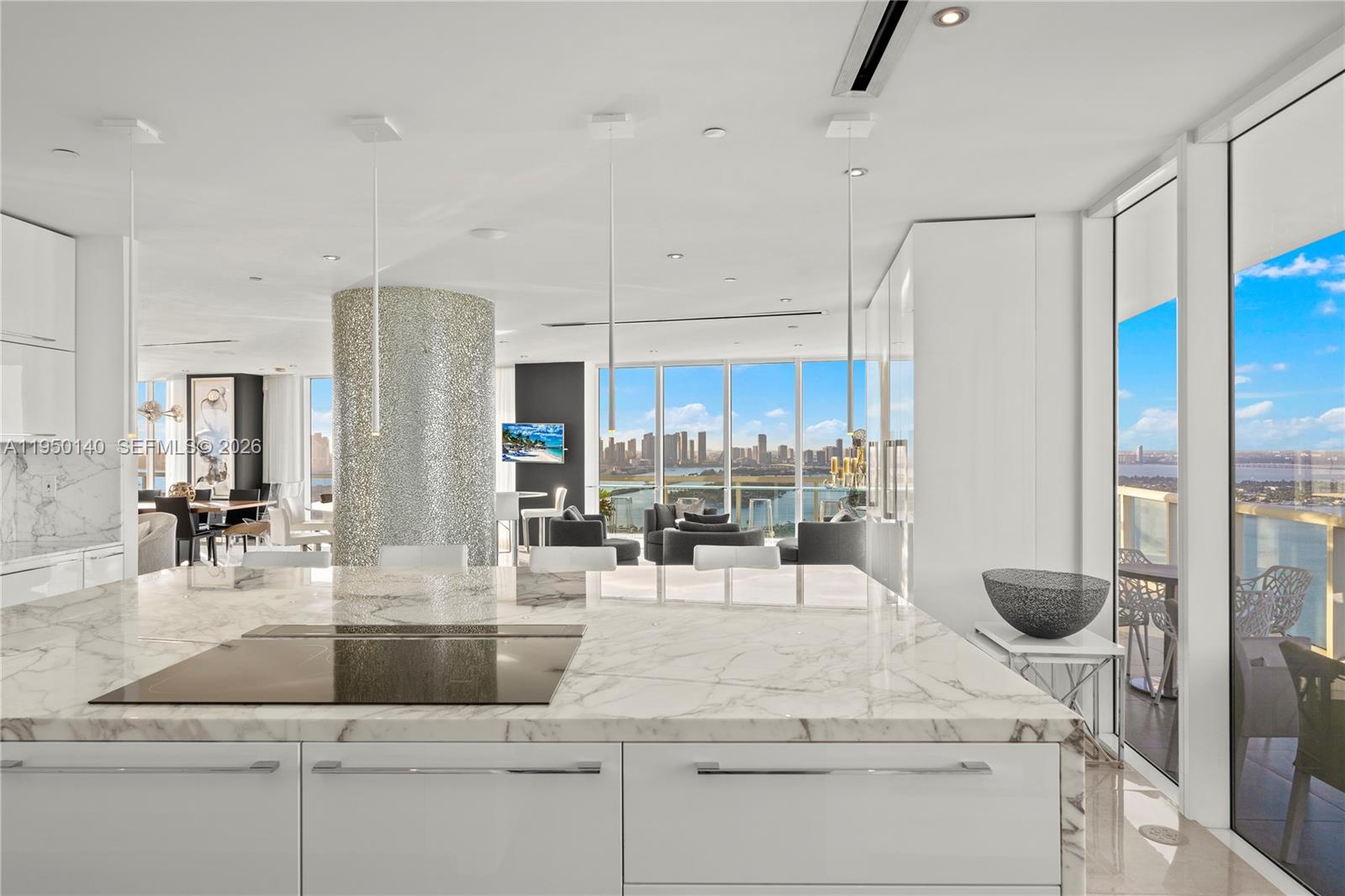 450 Alton Road, Unit PH1 Miami Beach, FL 33139 - Photo 42 of 98 a kitchen with stainless steel appliances kitchen island granite countertop a refrigerator and a sink