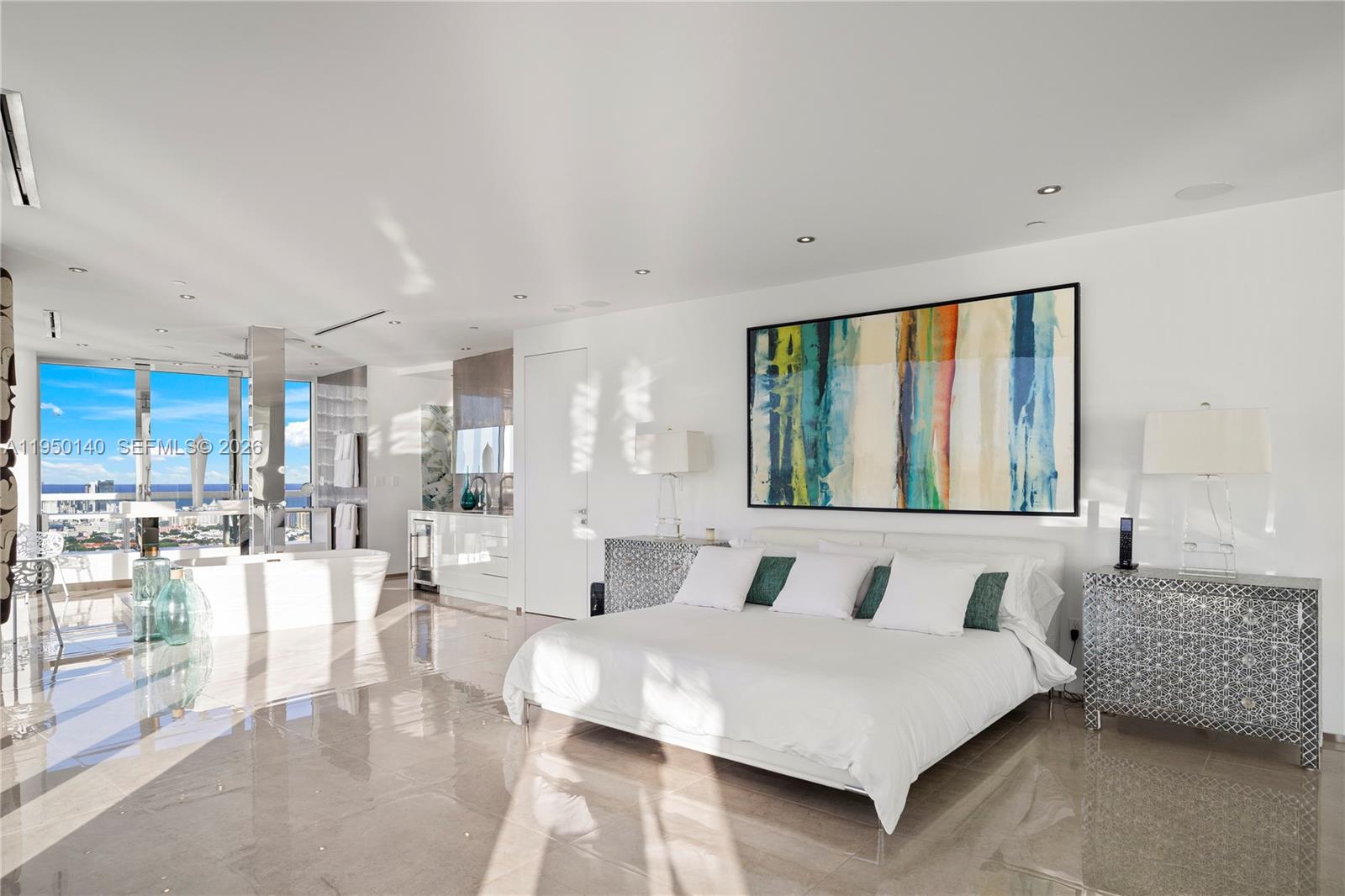 450 Alton Road, Unit PH1 Miami Beach, FL 33139 - Photo 46 of 98 a bedroom with a large bed and a large window