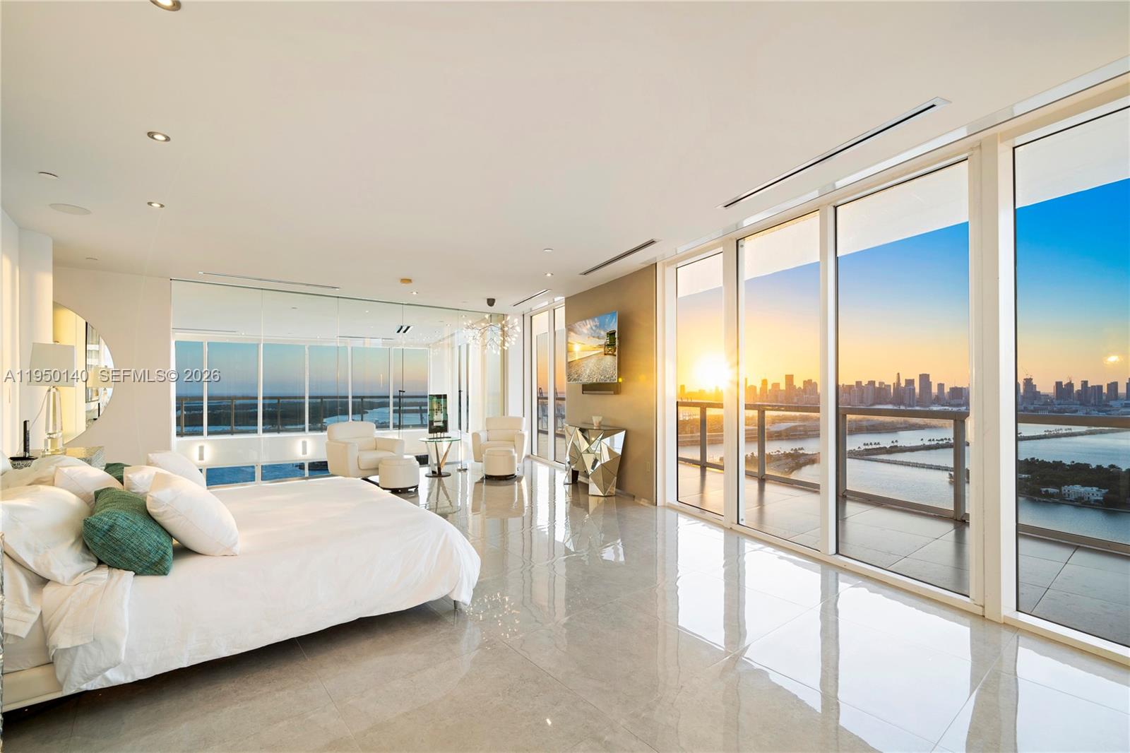 450 Alton Road, Unit PH1 Miami Beach, FL 33139 - Photo 55 of 98 a large bedroom with a large bed and glass windows