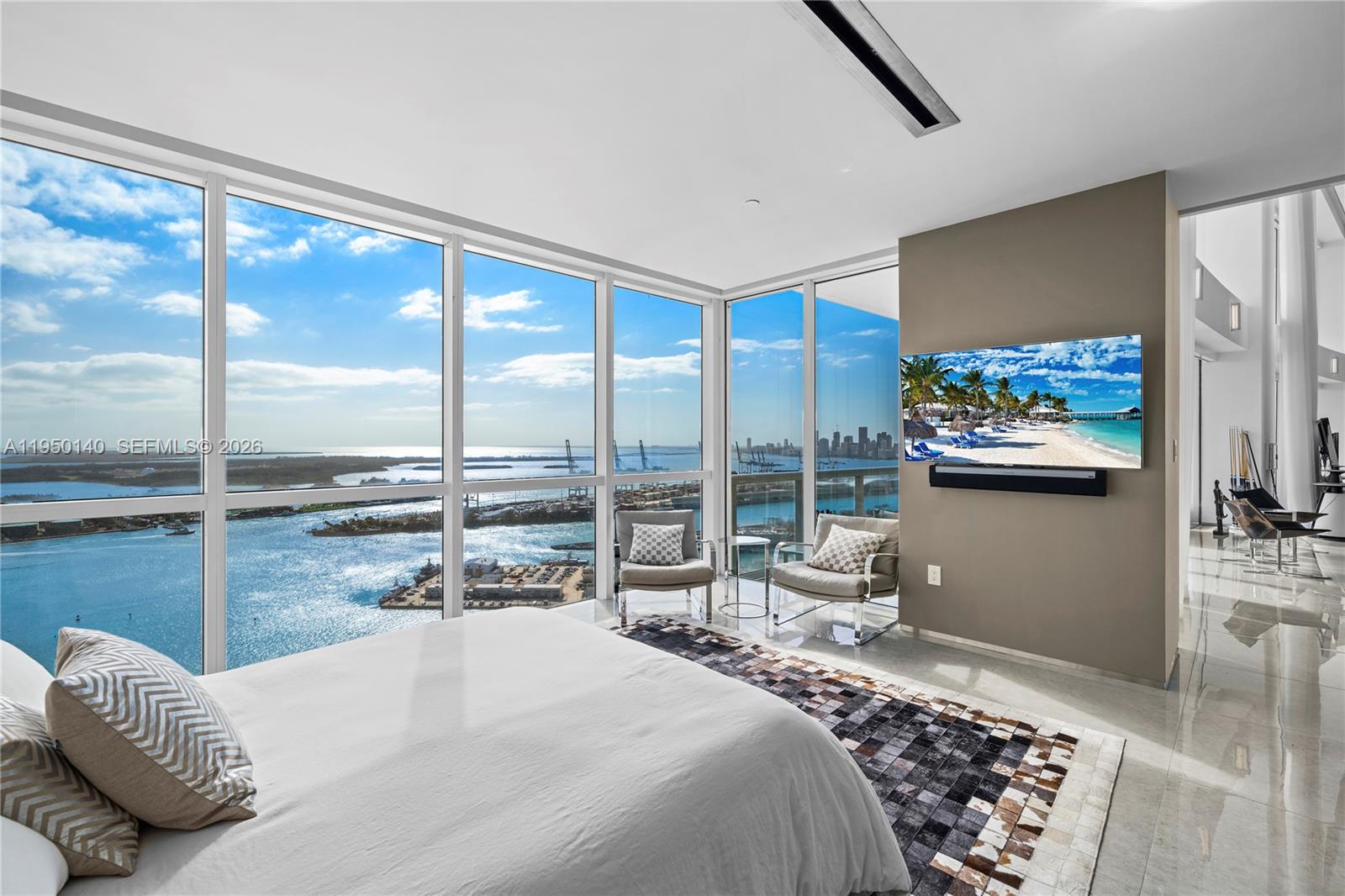 450 Alton Road, Unit PH1 Miami Beach, FL 33139 - Photo 62 of 98 a bedroom with a bed and glass wall painting