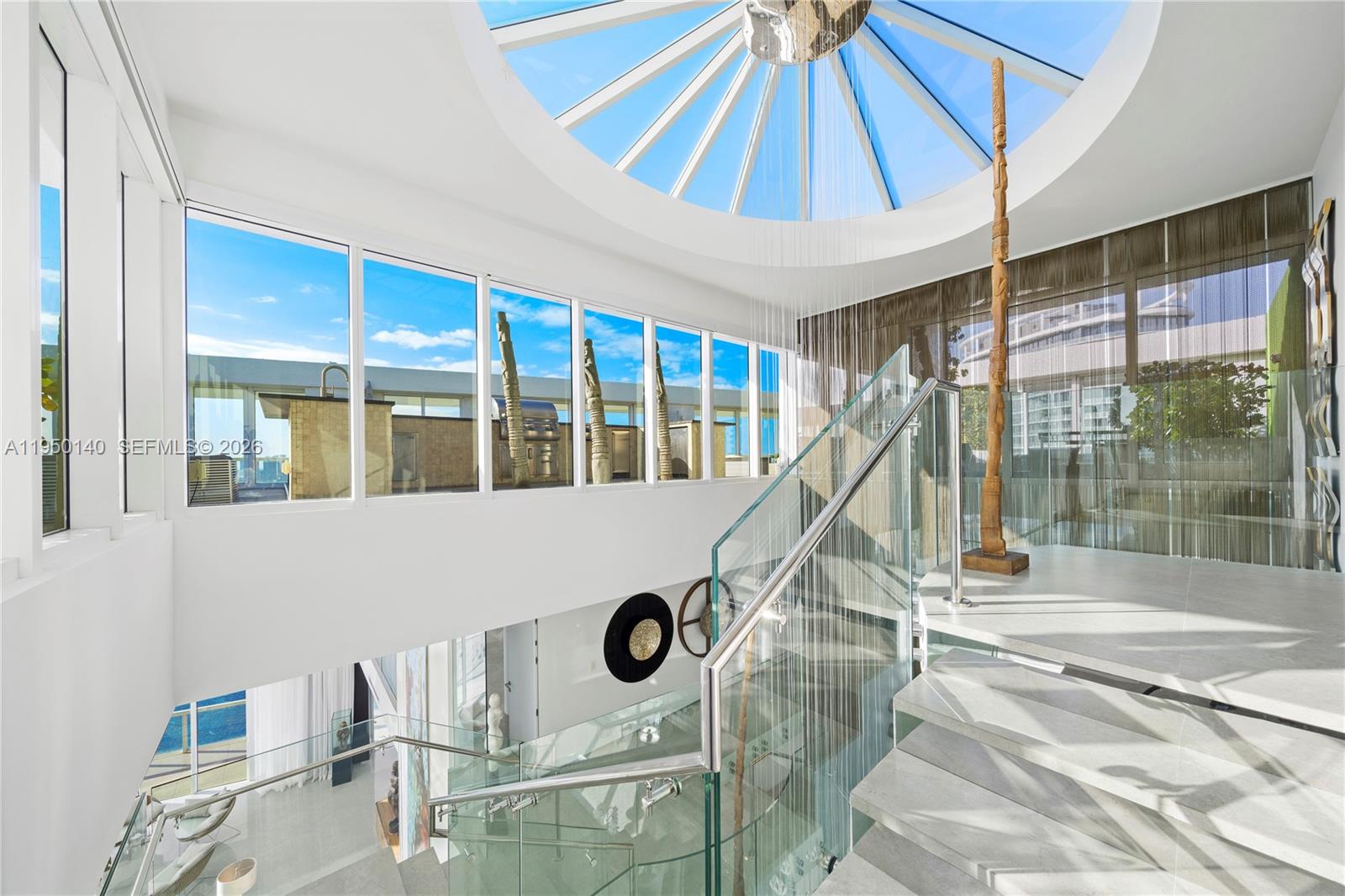 450 Alton Road, Unit PH1 Miami Beach, FL 33139 - Photo 7 of 98 a view of a livingroom with furniture and staircase