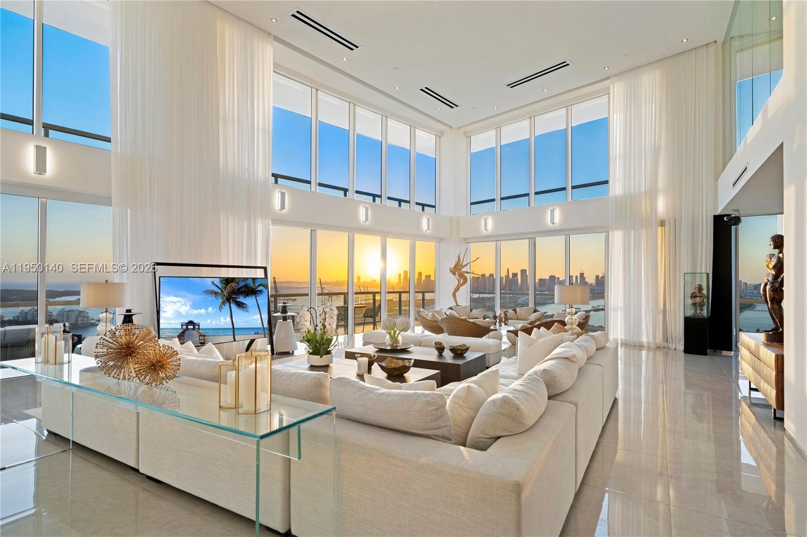 450 Alton Road, Unit PH1 Miami Beach, FL 33139 - Photo 84 of 98 a living room with furniture large windows a rug and white walls