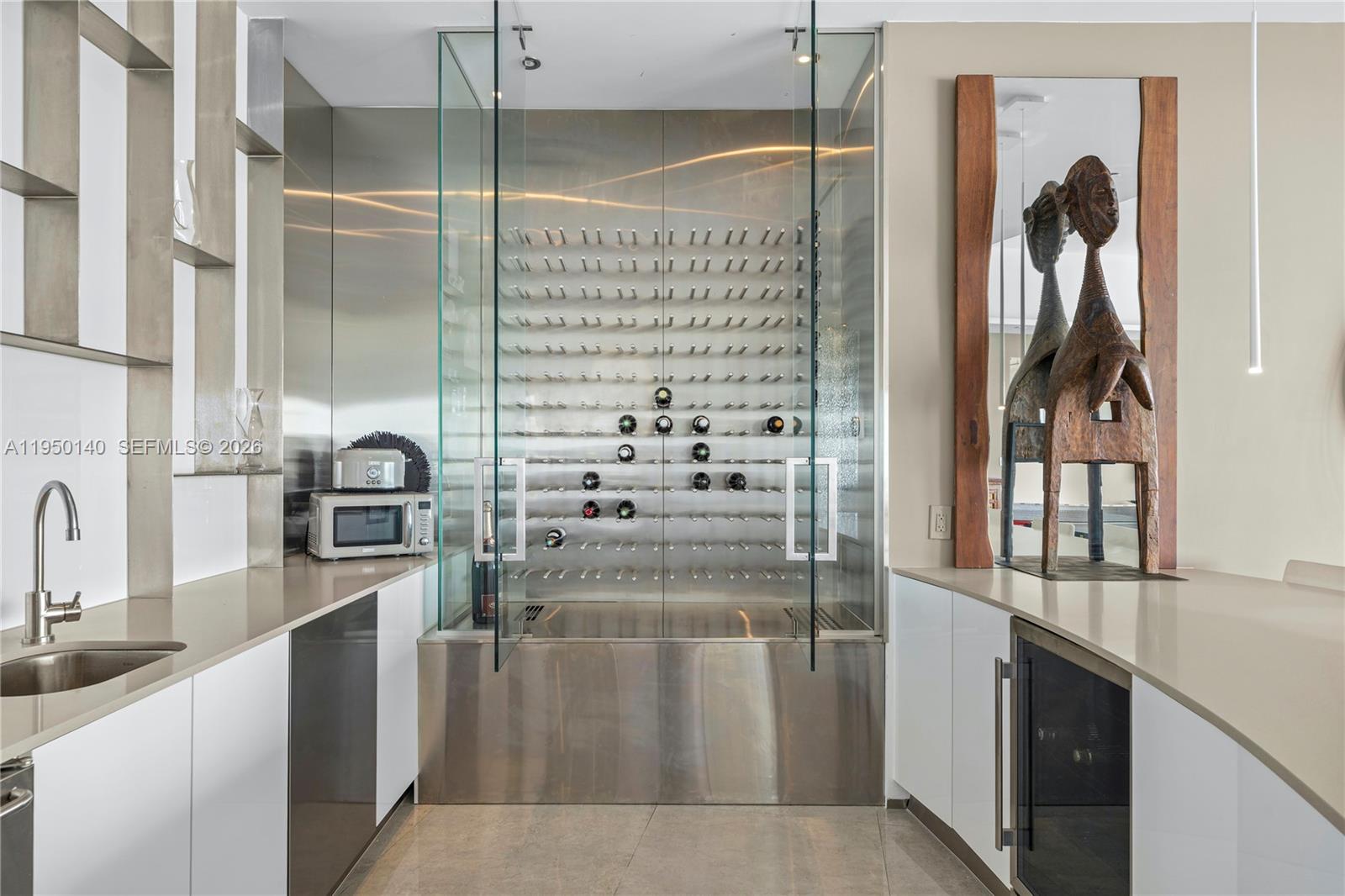 450 Alton Road, Unit PH1 Miami Beach, FL 33139 - Photo 88 of 98 a kitchen with refrigerator and cabinets