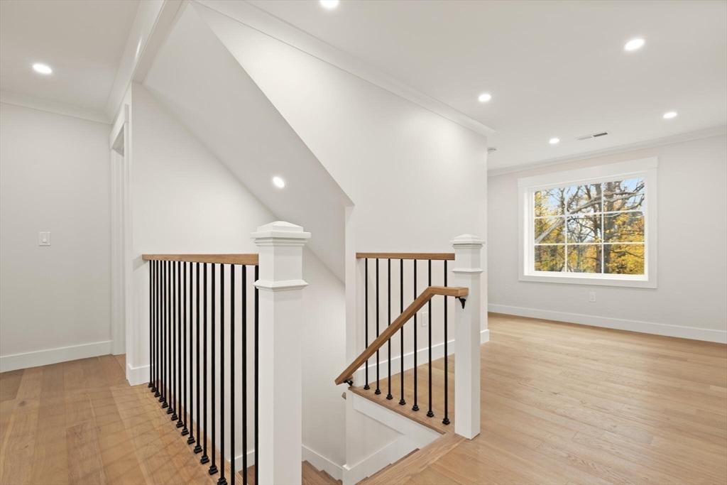 44 Buffington Street Attleboro, MA 02703 - Photo 23 of 41 an entryway of a hallway with wooden floor and windows