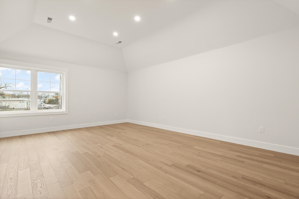 44 Buffington Street Attleboro, MA 02703 - Photo 24 of 41 an empty room with wooden floor and windows
